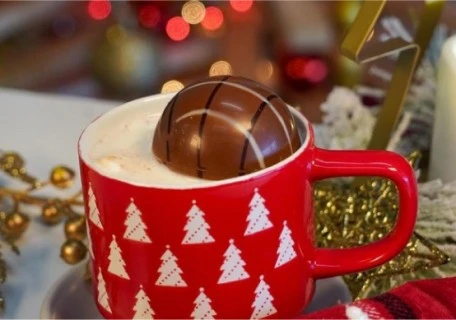 Hot chocolate mug with a chocolate ball melting