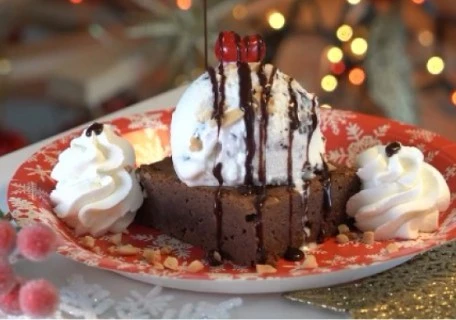 Delicious chocolate brownie with a scoop of ice cream